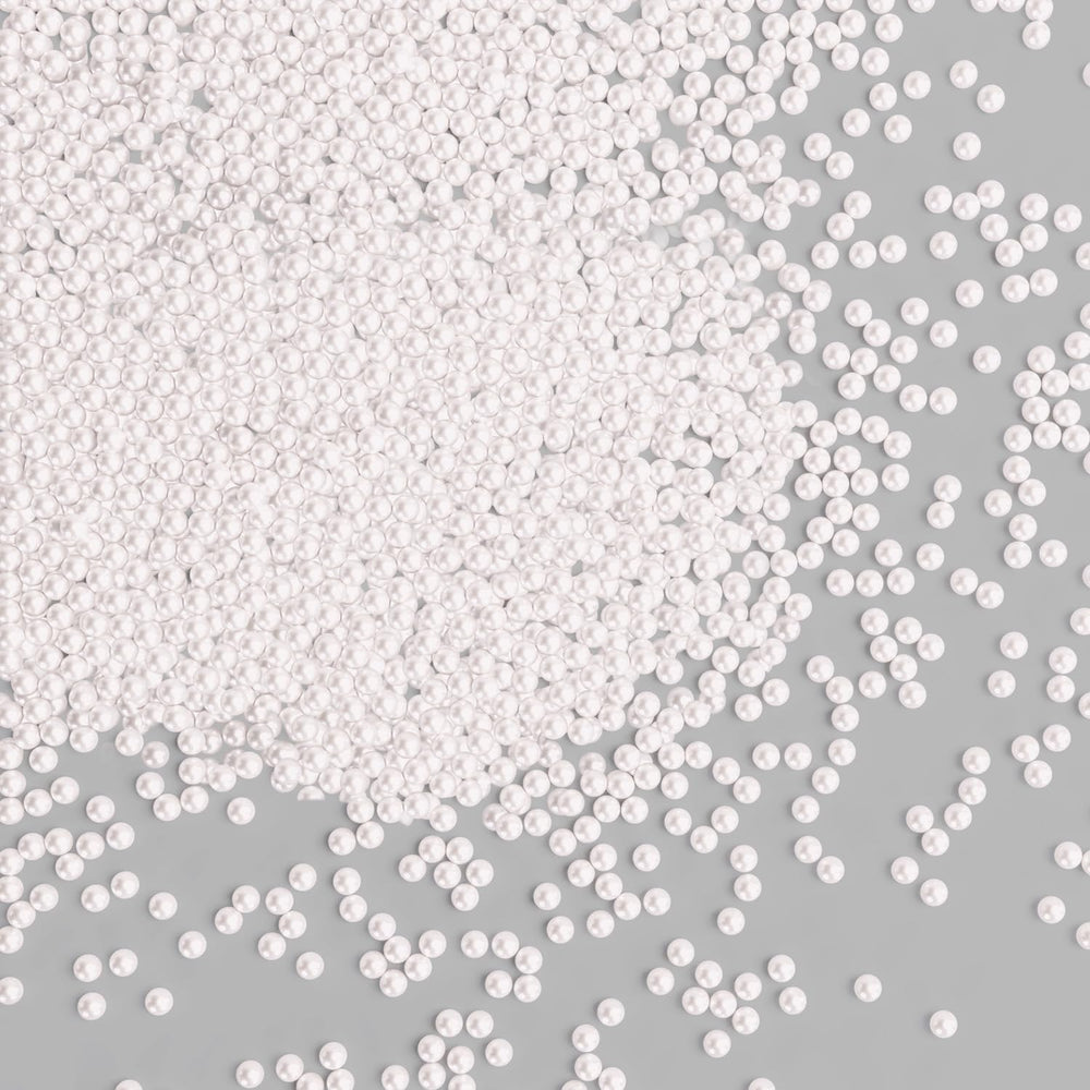 Bayep white edible pearls 2mm bottle adds a refined finishing touch to elegant desserts.