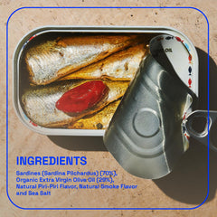 BELA Portuguese sardines served on a plate with herbs, ready to pair with bread.