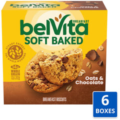 Belvita bar with coffee beside a mug for convenient breakfast.