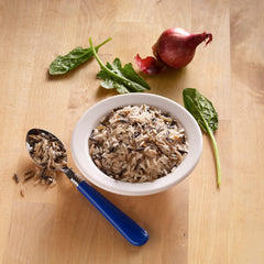 BEN'S ORIGINAL long grain and wild rice blend simmering on stovetop with 23 herbs