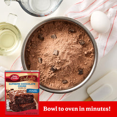Betty Crocker Delights Supreme Chocolate Chunk Brownie Mix bowl with dry mix and ingredients laid out