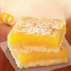 Betty Crocker Delights Supreme Lemon Bars oven-baking scene evokes warm kitchen aroma.