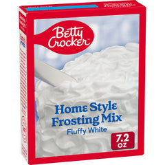 Betty Crocker HomeStyle Fluffy White Frosting Mix bottle pour shows creamy, ready-to-use frosting.
