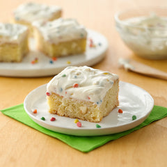 Betty Crocker Rainbow Chip Frosting jar spread for quick, creamy topping on cupcakes.