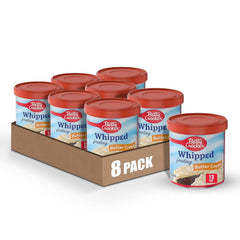 Betty Crocker Whipped Butter Cream Frosting carton open; quick, smooth topping for cakes.