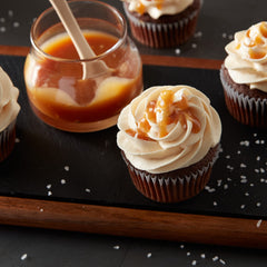 Betty Crocker Whipped Butter Cream Frosting spread on cake; easy decoration and coverage.