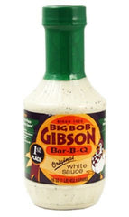 Big Bob Gibson Original White Sauce bottle pouring, ideal for dipping and finishing BBQ.