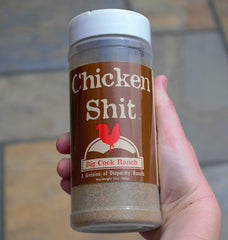 Big Cock Ranch Chicken Shit seasoning bottle pour shows easy, controlled application.