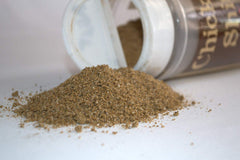 Big Cock Ranch Chicken Shit seasoning jar close-up reveals the textured spice blend.