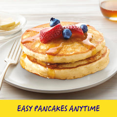 Bisquick Original Waffles cooking on a griddle for crisp edges