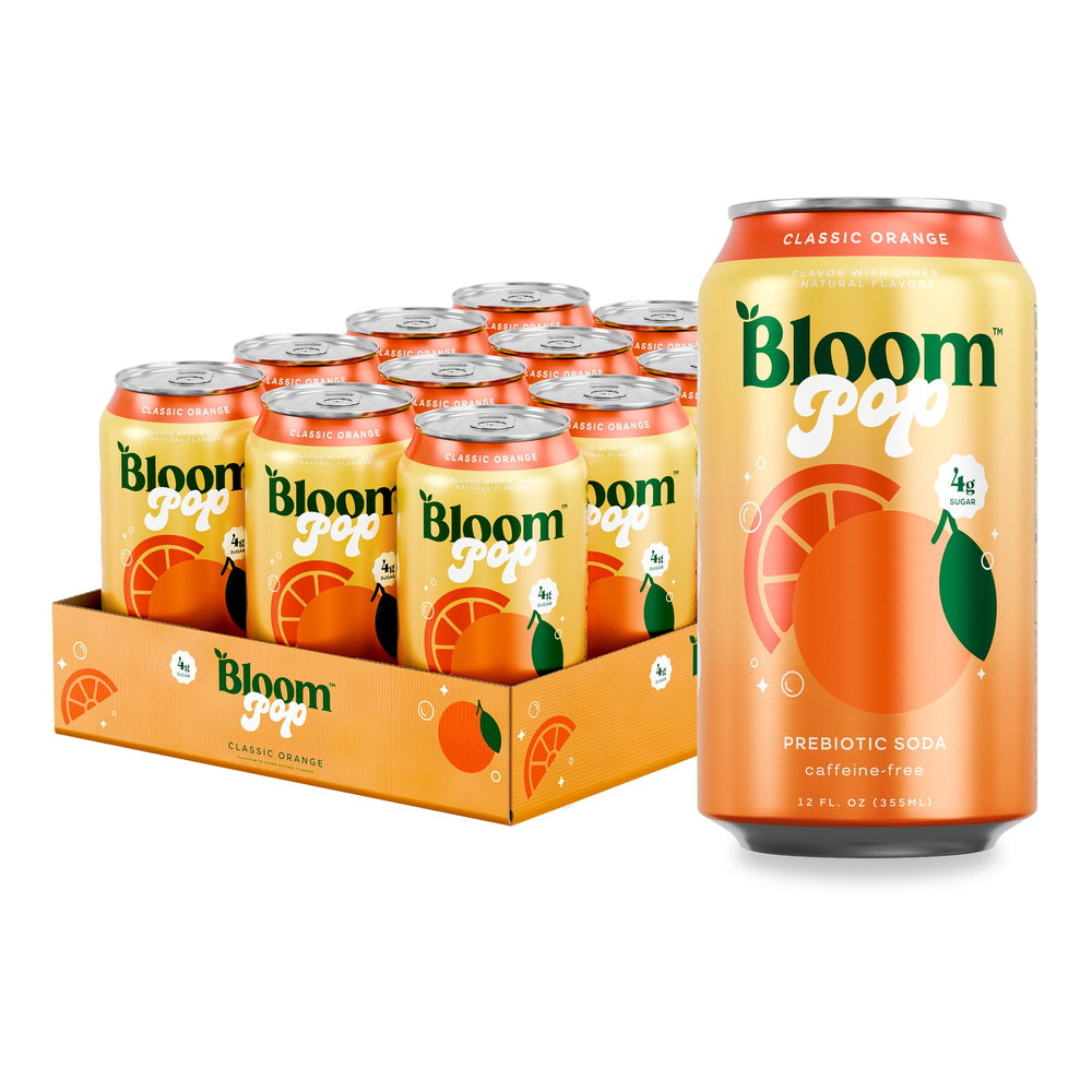 Bloom Pop Classic Orange can on table, a refreshing low-calorie, caffeine-free beverage.