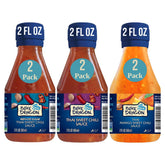 Blue Dragon mini reduced sugar Thai sweet chili sauce bottle for dipping savory snacks.