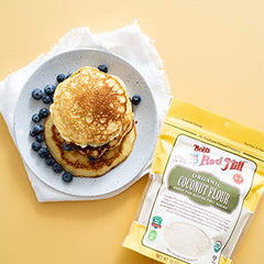 Bob's Red Mill organic coconut flour on a baking tray beside ingredients