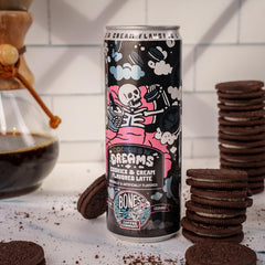 Bones Coffee Cookies N' Dreams Latte can pouring to reveal creamy latte texture.