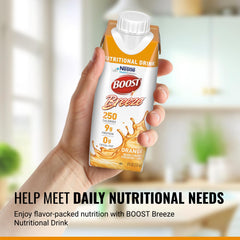BOOST Breeze clear orange liquid in a glass, light and refreshing.