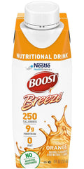 Pouring BOOST Breeze Orange into a glass for easy serving.