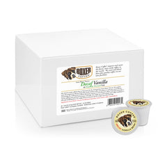 Boxer Coffee decaf pods held in hand showcase the 48 count eco box.