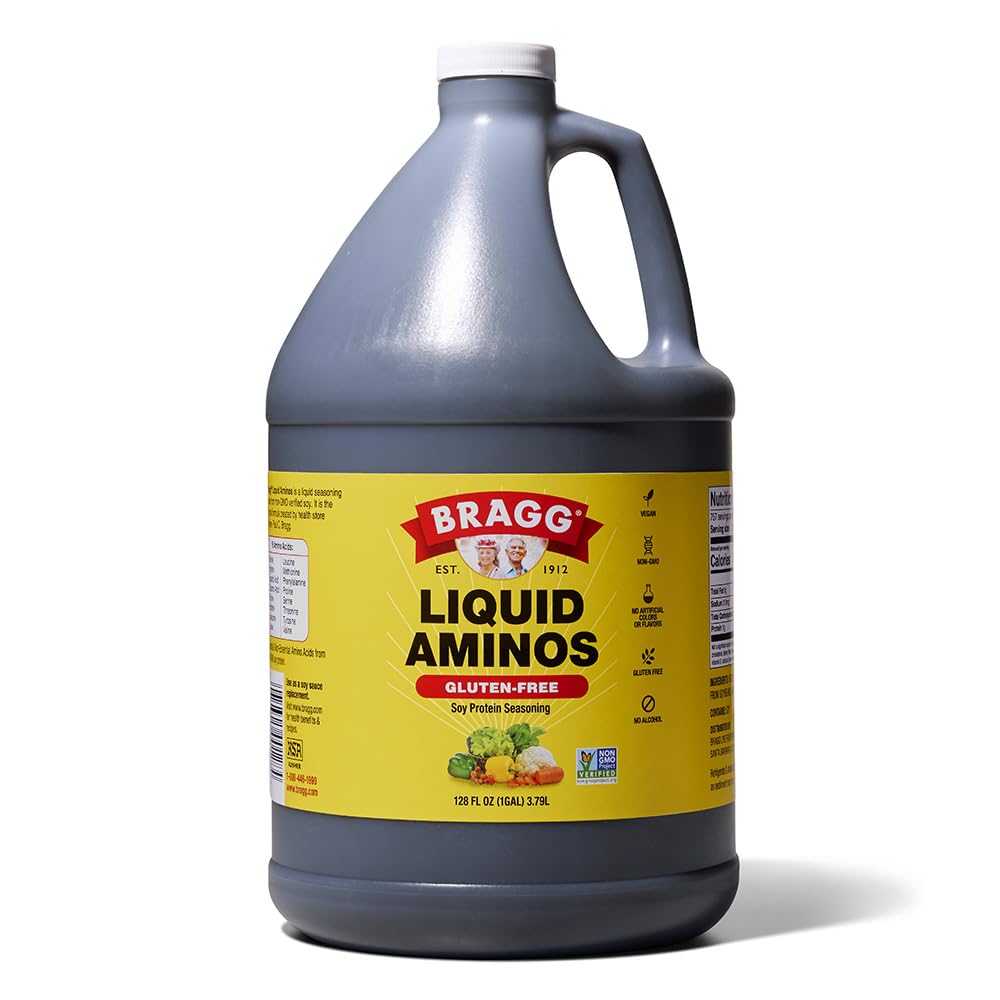 Bragg Liquid Aminos bottle pouring over a sizzling stir-fry for savory flavor
