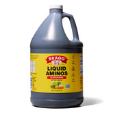 Bragg Liquid Aminos bottle pouring over a sizzling stir-fry for savory flavor