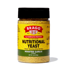 Bragg Nutritional Yeast Roasted Garlic bottle showing dairy-free parmesan substitute for meals