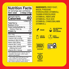 Bragg nutritional yeast seasoning bottle close-up with powder texture and label.