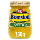Branston Piccalilli 360g jar on kitchen counter, tangy crunch ready to elevate meals.