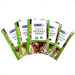 Breadtopia Lesaffre Red Star Organic Instant Yeast five packets on shelf for reliable bread rises.