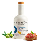 Brightland Alive olive oil bottle front view, ideal for vibrant salads.