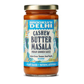 Brooklyn Delhi Golden Coconut Curry bottle pour, a mild vegan sauce for quick weeknight meals