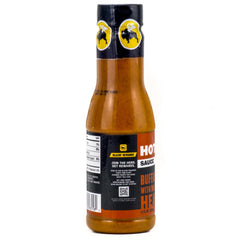 Buffalo Wild Wings hot sauce bottle plated with wings, bold flavor.