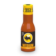 Buffalo Wild Wings Medium Buffalo Sauce bottle pouring over wings for bold flavor