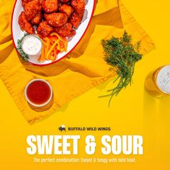 Close-up pour of Buffalo Wild Wings Sweet and Sour Sauce for glaze