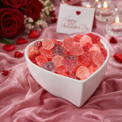 Buha Sweets vibrant red sour gummies displayed on a party table.