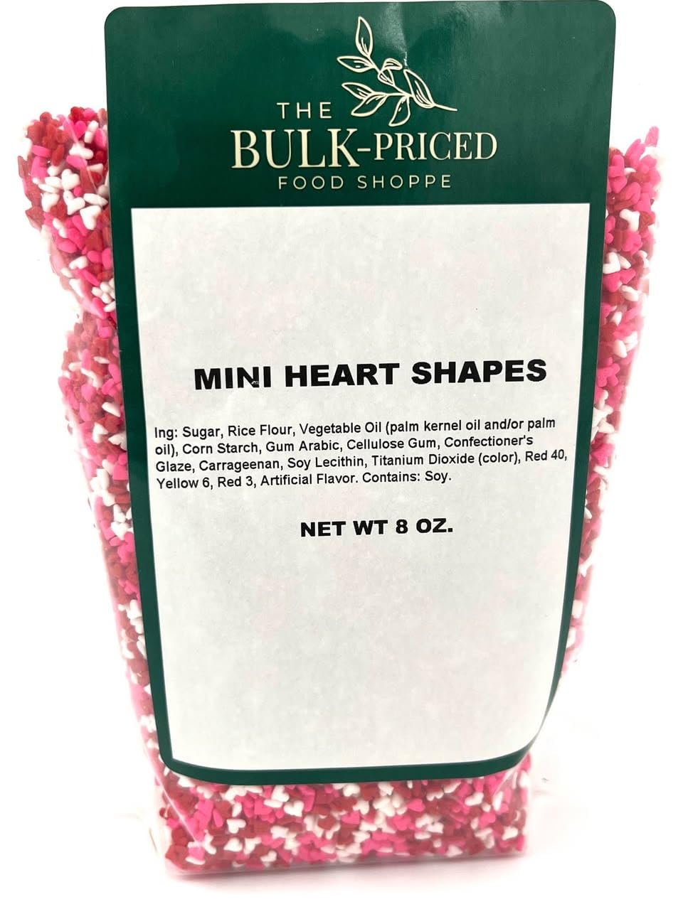 The Bulk-Priced Food Shoppe mini heart sprinkles decorate cupcakes with red, white, and pink.