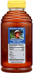 Buzzn Bee raw Florida honey pour in amber bottle ready for tea.