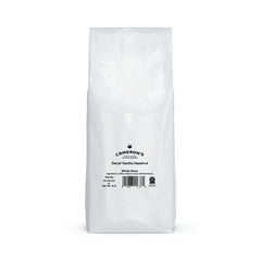 Steaming cup of Cameron's Decaf Vanilla Hazelnut with smooth aroma.