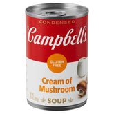 Campbell's gluten free cream of mushroom soup can being poured into a pan for easy weeknight meals