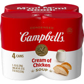 Campbell's Cream of Chicken Soup four-pack cans on a shelf, a convenient pantry staple.