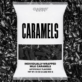 Candy Envy caramels with black wrappers displayed for gifting
