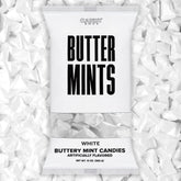 Candy Envy white-wrapped buttermints on a display tray, ideal for weddings.