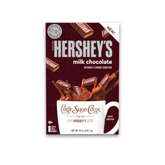 Tall glass of iced Candy Shop Cocoa Mix ready as a refreshing chocolate drink.