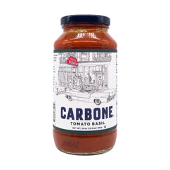 Carbone sauce bottle on kitchen counter with basil garnish