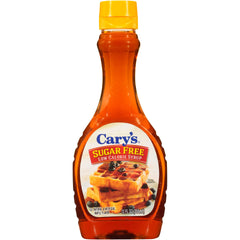 Cary's Sugar Free Low Calorie Syrup bottle pour enhances pancakes with a light maple flavor.