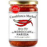Casablanca Market Harissa bottle being poured for bold Moroccan flavor.