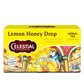 Celestial Seasonings Lemon Honey Drop tea bags beside a lemon slice for a refreshing, caffeine-free moment.