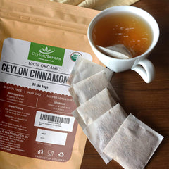 CEYLONFLAVORS Cinnamon tea bag steeped in hot water releasing warm aroma