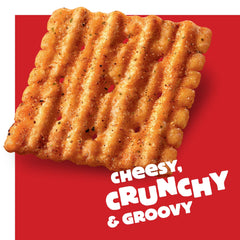 Cheez-It Grooves Loaded Nacho crackers beside dip for party snacking.