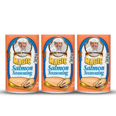 Chef Paul Prudhomme's Salmon Magic Seasoning bottle pour enhances bold seafood flavor.