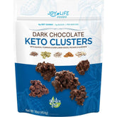 chimoo dark chocolate keto clusters closeup shows pecans, almonds, and coconut with super seeds.