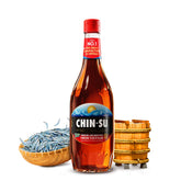 CHIN-SU fish sauce bottle pouring for rich umami in meals.